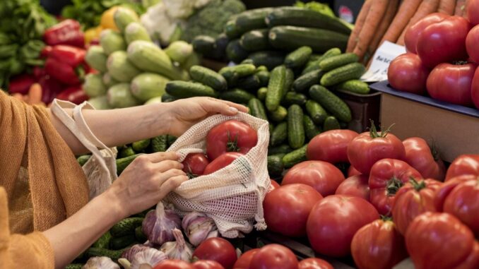 woman-buying-tomatoes-from-market-place-1536x1238